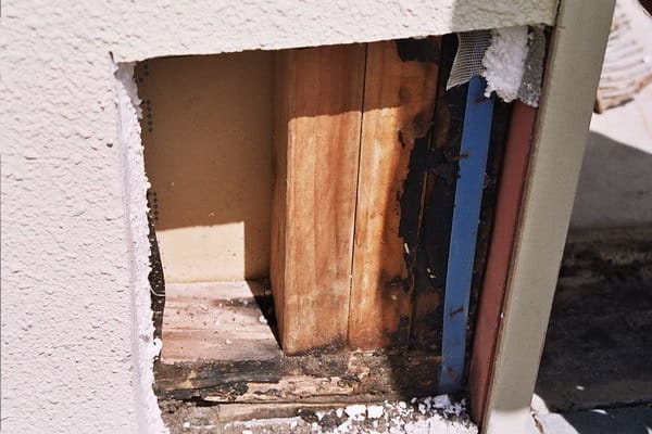 Cladding Close to Paving at Garage Door Resulting Damage Risk House - Cladding Close to Paving at Garage Door Resulting Damage